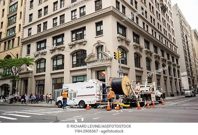 Verizon workers install cable in the Flatiron neighborhood of New York