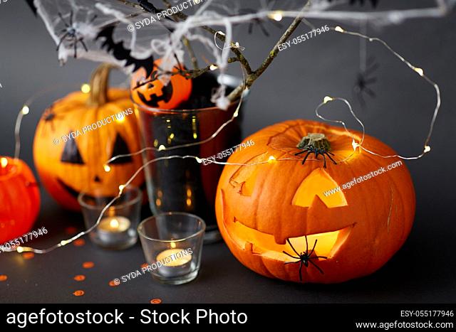 pumpkins, candles and halloween decorations