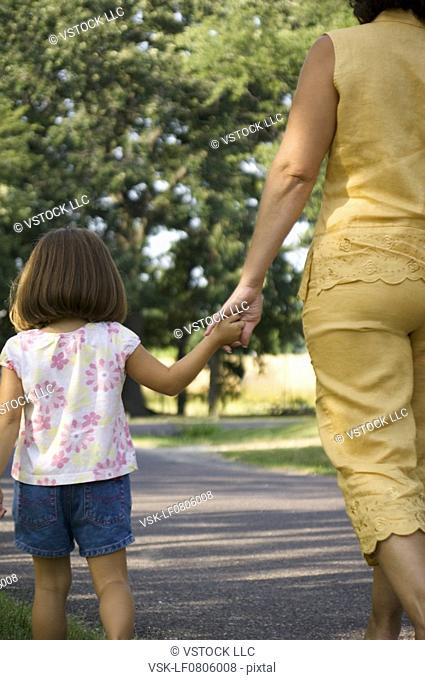 Grandma and granddaughter taking a walk