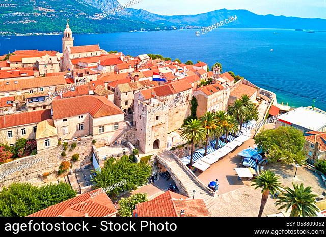 Historic town of Korcula towers and town gate aerial panoramic view, island in archipelago of southern Croatia