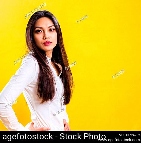Young self-confident woman in a studio - studio photography