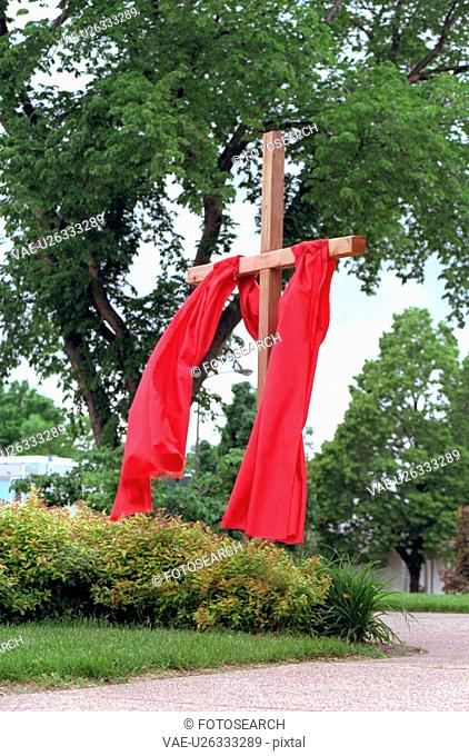 Wooden cross draped with red cloth at Gloria Dei Lutheran Church