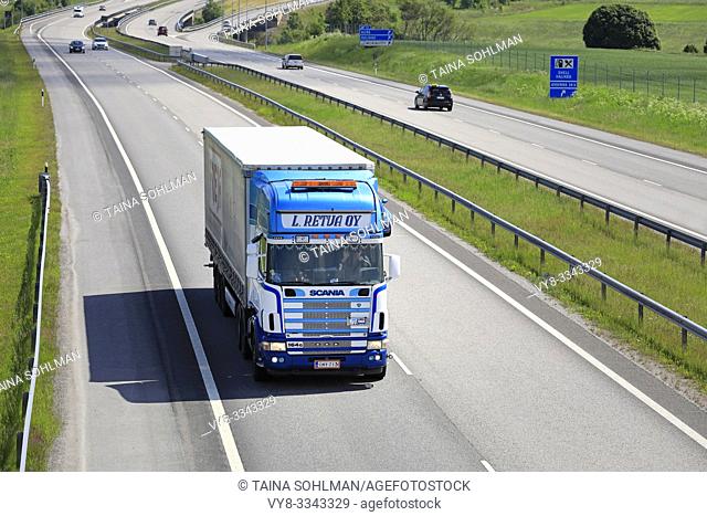 Salo, Finland. June 15, 2019. Blue-white Scania 164G L Retva Oy pulls trailer along European Route E18 in South of Finland on a sunny day of summer