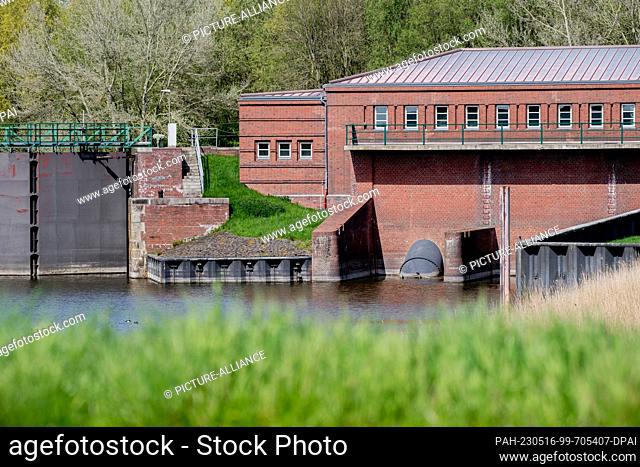 PRODUCTION - 04 May 2023, Lower Saxony, Emden: The Borssum pumping station stands on a canal near the River Ems in the southeast of the city