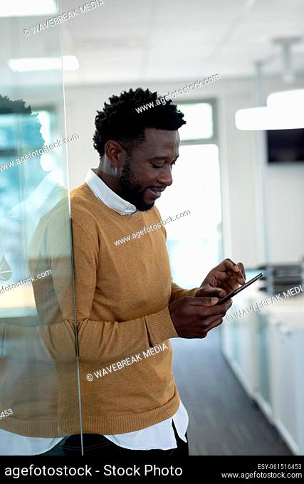 Businessman using smartphone at modern office