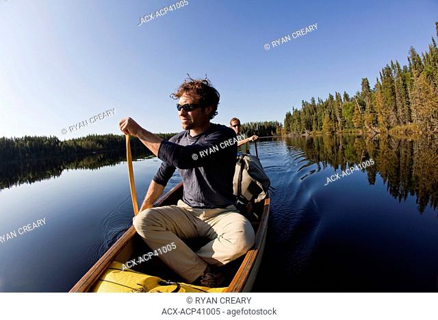 Men canoeing and camping for 2 weeks in Wabakimi Provincial Park, Northern Ontario, Canada