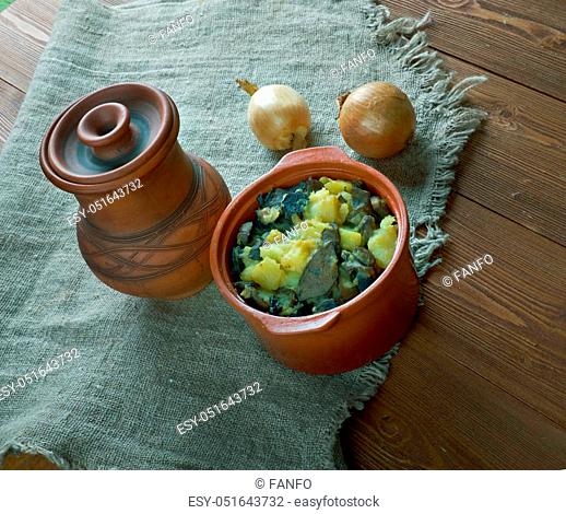 Mushroom Tushanka- Belarusian potato stew on a wooden background