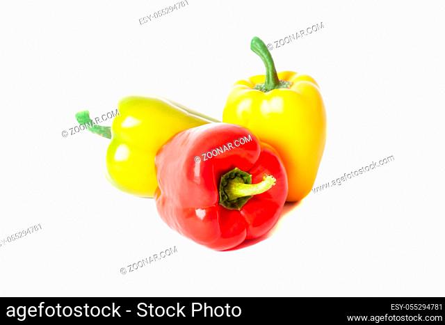 Fresh sweet peppers isolated on white background. Close-up photo of peppers green, yellow and red color