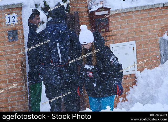 People enjoy with snow in a residential street of Mostoles on January 9, 2021 in Madrid. Spain is on red alert for a second day due to storm Filomena
