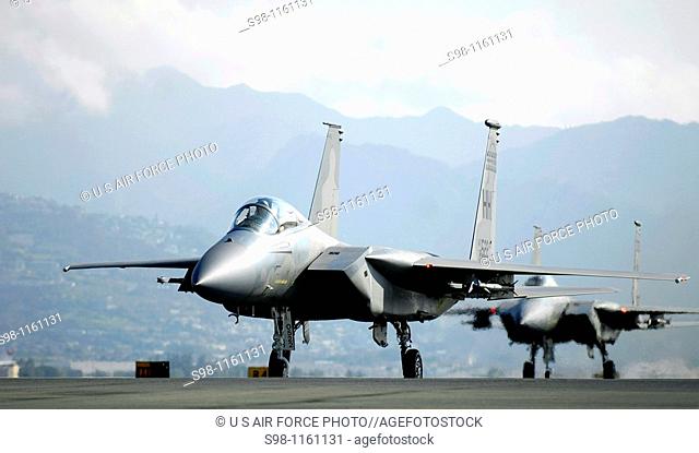 F-15 Eagles taxi on the flightline after flying a mission Jan  9 at Hickam Air Force Base, Hawaii  The F-15s, from the 199th Fighter Squadron of the Hawaii Air...
