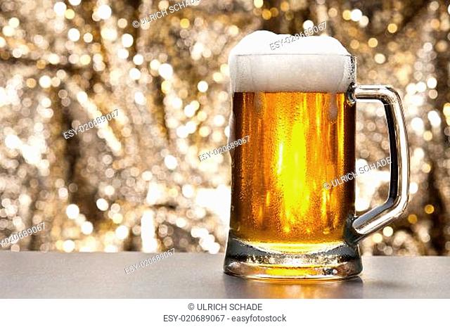 Beer mug in front of a glittering background, Stock Photo, Picture And Low  Budget Royalty Free Image. Pic. ESY-020689067 | agefotostock
