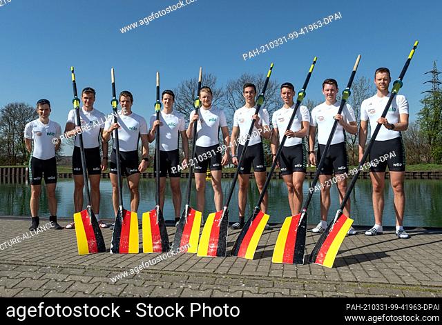 31 March 2021, North Rhine-Westphalia, Dortmund: Rowing: Media Day Germany Eight: The team of the Germany Eight stands at the Dortmund-Ems Canal: cox Martin...