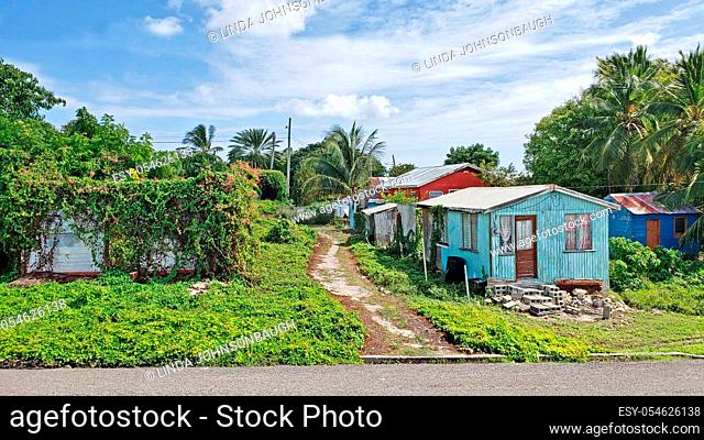 Three colorful typical homes in Antigua Barbuda Lesser Antilles, West Indies, Caribbean