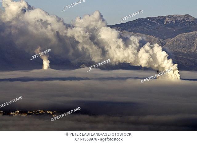 The town of Megalopoli, bottom left of picture, shrouded in a mixture of fog, and smog from the local power stations, Arcadia, central Peloponnese