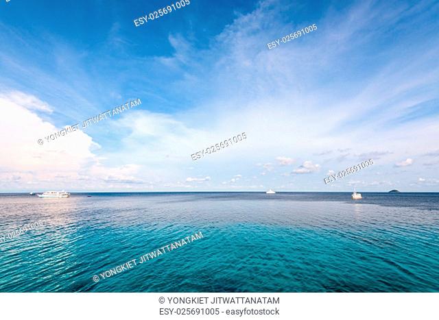 Background blue sky and cloud in summer over Andaman Sea at Honeymoon Bay in Mu Koh Similan island National Park, Phang Nga Province, Thailand
