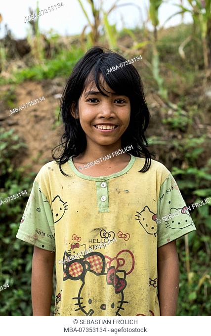 Indonesian girl, smiling, looking to the camera, portrait