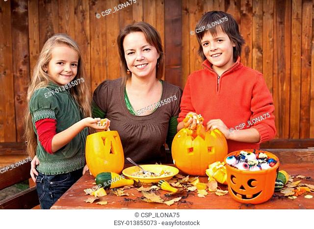 Happy family preparing for Halloween