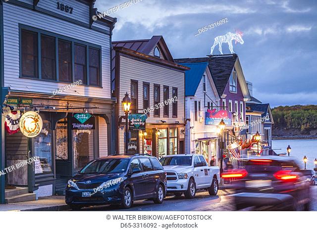 USA, Maine, Mt. Desert Island, Bar Harbor, restaurants along Main Street, autumn, dusk