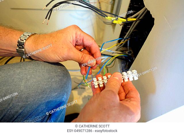 Man doing wiring and connecting wires