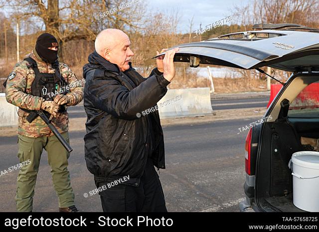 RUSSIA, BRYANSK REGION - MARCH 3, 2023: A vehicle is checked at a checkpoint in the village of Sachkovichi. On 2 March 2023
