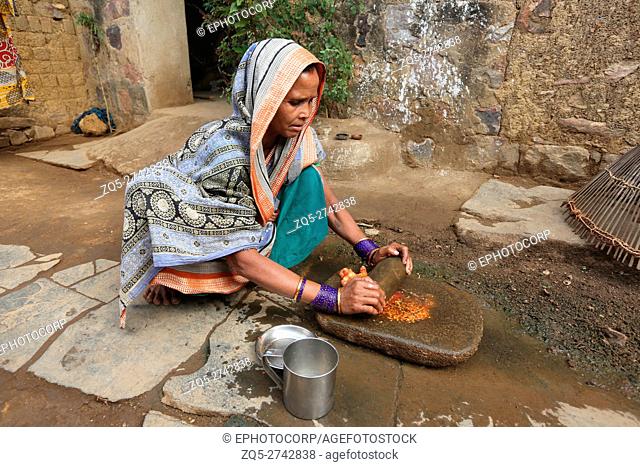 Woman making tomato paste, KOND TRIBE, Taluka Saraipalli, Dist Mahasamundh, Chattisgarh, India