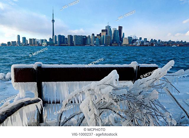 Icicle covered park bench overlooking the Toronto skyline - Toronto, Ontario, CANADA, 18/02/2006