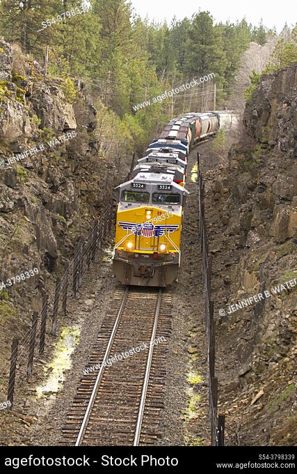Union Pacific freight train coming through a rock cut in Cheney, Washington, USA