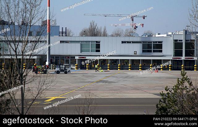 22 February 2021, Brandenburg, Schönefeld: No aircraft is parked in front of the departures and arrivals hall on what is provisionally the last day of operation...