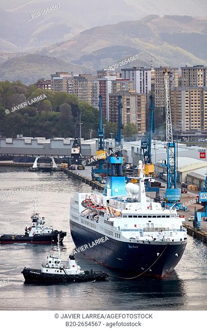 Berthing. Tugboat and cruise liner. Passenger ship. Tug maneuvers. Pasaia Port. Gipuzkoa. Basque Country. Spain. Europe
