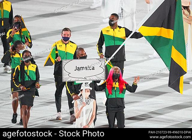 23 July 2021, Japan, Tokio: Olympics: Opening ceremony at the Olympic Stadium. The Jamaican team with flag bearers Shelly-Ann Fraser-Pryce and boxer Ricardo...