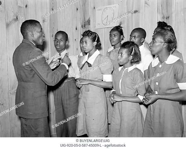African American School choir led by Robert Pierce, school principal. They won state championship. Gee's Bend, Alabama 1939