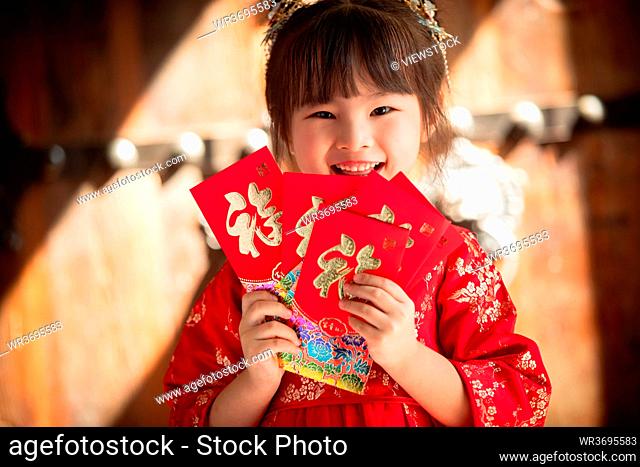 Cute girl with a red envelope