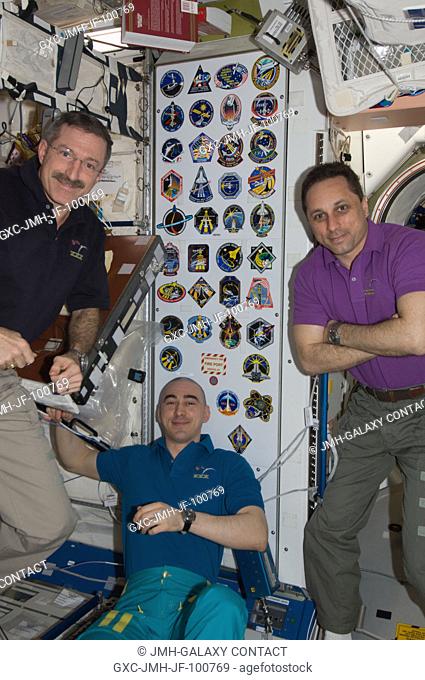 In the Unity node, NASA astronaut Dan Burbank (left), Expedition 30 commander; along with Russian cosmonauts Anton Shkaplerov (right) and Anatoly Ivanishin