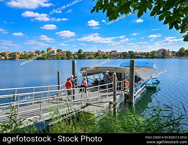 PRODUCTION - 11 August 2023, Brandenburg, Strausberg: A cable ferry stands on the western side of Lake Straus. The lake has lost half of its water for about ten...