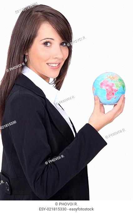 Young woman holding globe