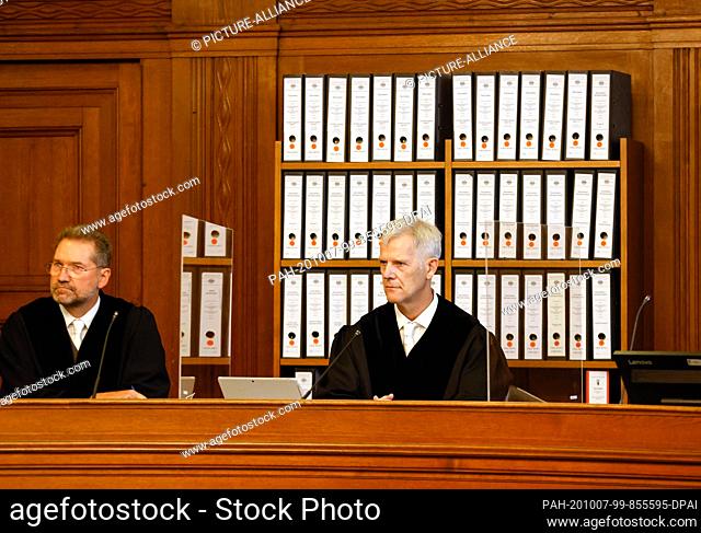 07 October 2020, Berlin: Judge Olaf Arnoldi (r) sits next to a colleague in the courtroom of the Moabit criminal court at the beginning of the trial about the...