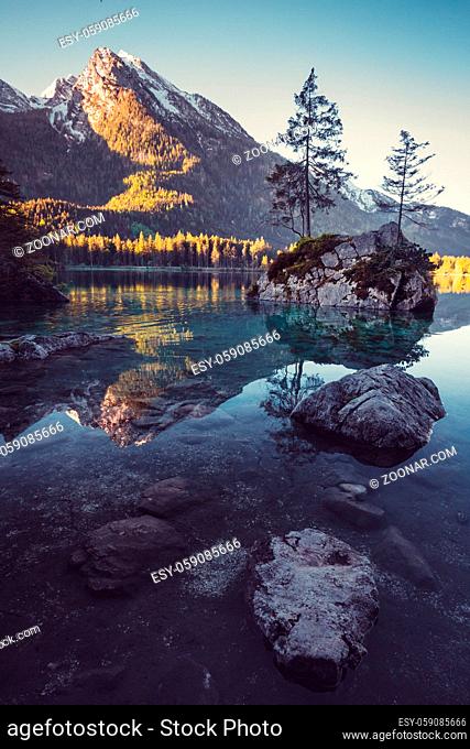Sunrise at lake Hintersee in the Alps of Bavaria on a beutiful day in spring with reflections