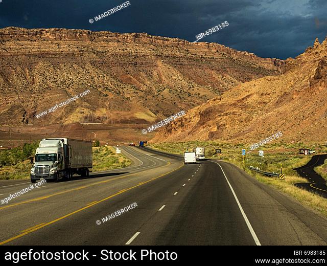 Truck on highway towards Arches Scenic Drive and Arches National Park, near Moab, Utah, USA, North America