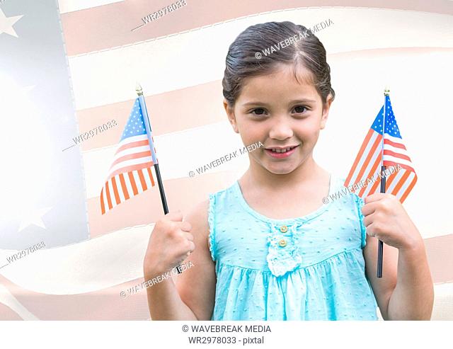 ILittle girl holding Americans flags against american flag