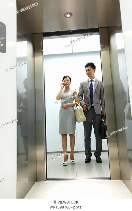 Business people in the elevator