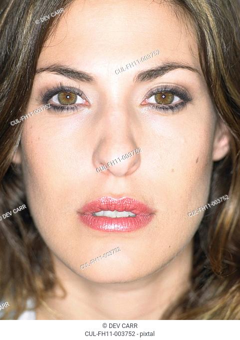 Close up portrait of young woman's face, serious expression, Alicante, Spain