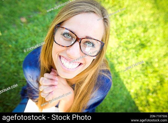 Fun Wide Angle Portrait of Pretty Young Woman at the Park