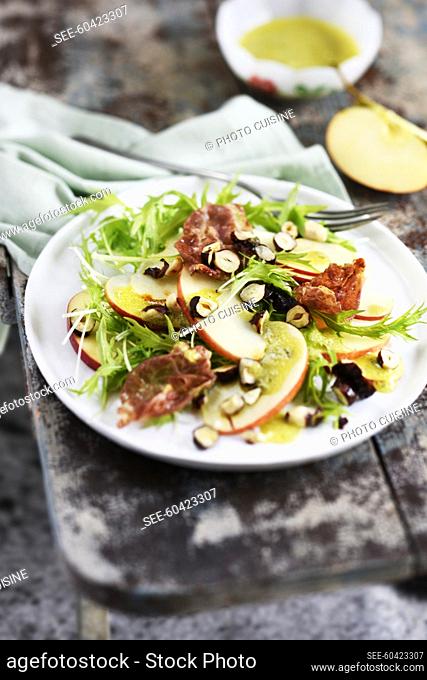 Apple, mizuni leaves, crispy coppa and caramelized hazelnut salad