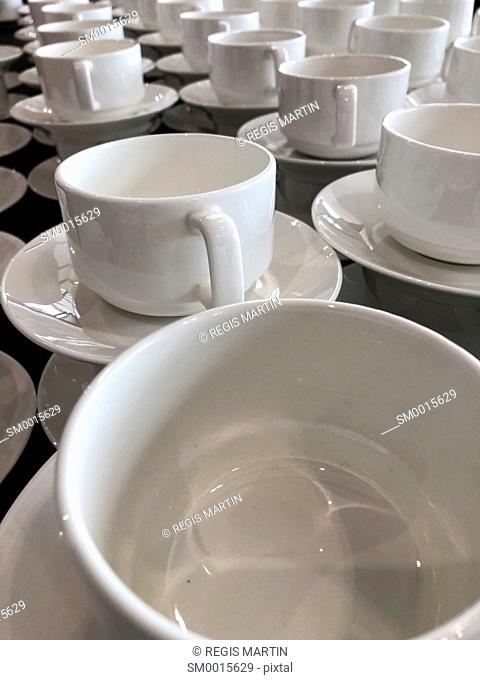 White empty ceramic cups at a buffet