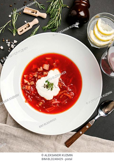 Red soup in bowl with sour cream
