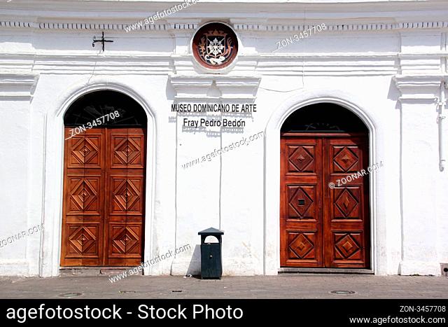 White wall and two wooden doors of museum in Quito in Ecuador