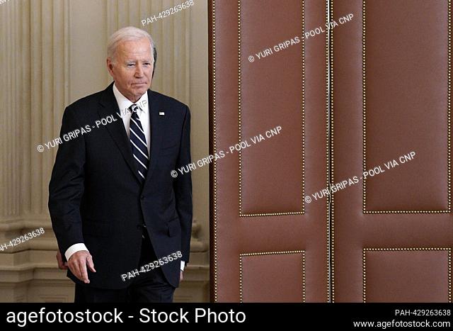 United States President Joe Biden arrives to deliver remarks on the Hamas terrorist attacks in Israel in the State Dining Room of the White House in Washington