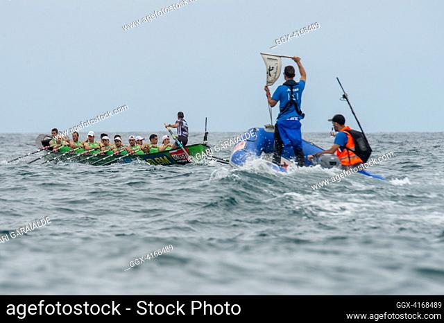 Crew of Hondarribia rowing boat in action during XLVI Zarauzko Ikurrina men’s regatta of the ACT League (The Association of Clubs of rowing boats)