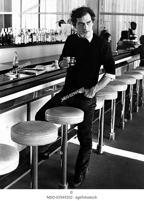 Italian actor and scenarist Gian Maria Volonté drinking at the bar. Opatjia, 1970s