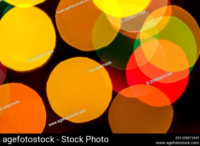 Abstract bokeh christmas lights background with yellow, orange, green and red colours